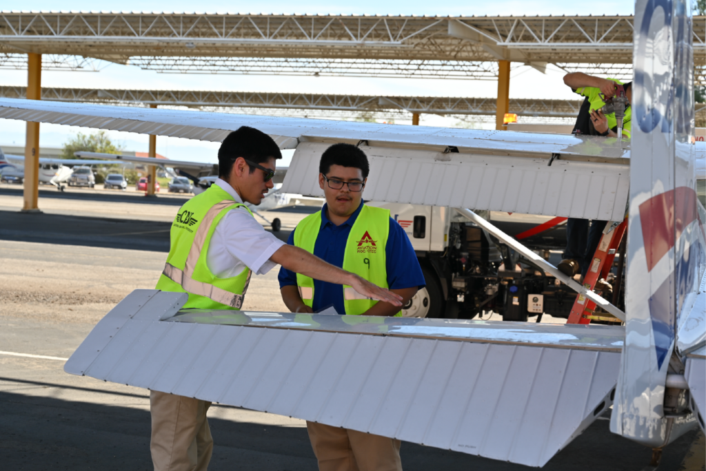 instructor-showing-student-airplane